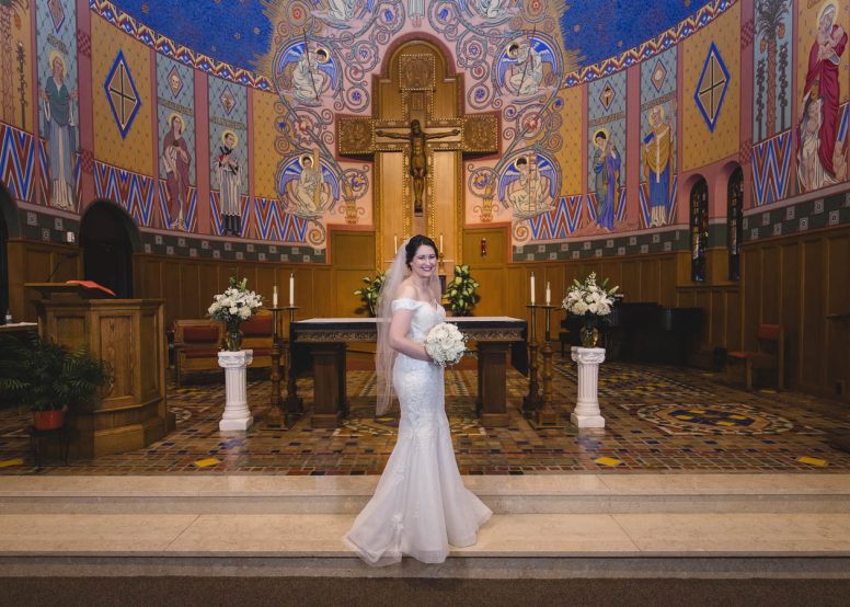 Bride in front of church alter
