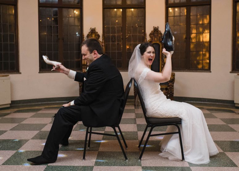 Bride and groom laughing during wedding reception